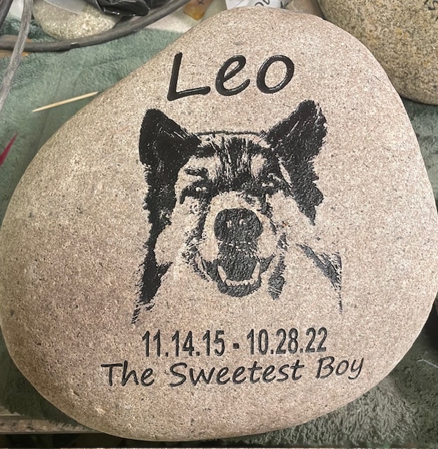 Engraved pet memorial with text Leo the sweetest boy with a custom graphic of the dog