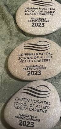 Three engraved stones that all say Griffin Hospital School of Allied Health Careers, Naugatuck grand opening 2023.