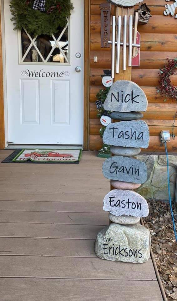 Beautiful 5 tier stacker engraving on the porch of a cabin that gives a warm, welcoming feeling.