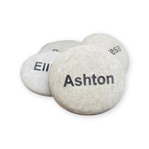 White name rocks, front rock has the name Ashton engraved on it