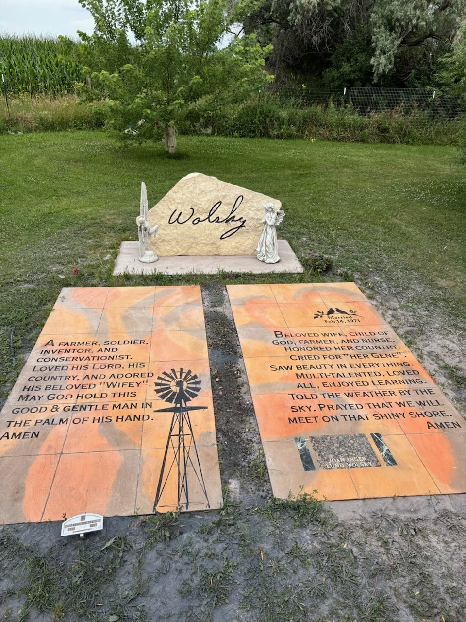 Memorial stone with engraving Wolshy and two ground inlays that tell a story about the peoples lives