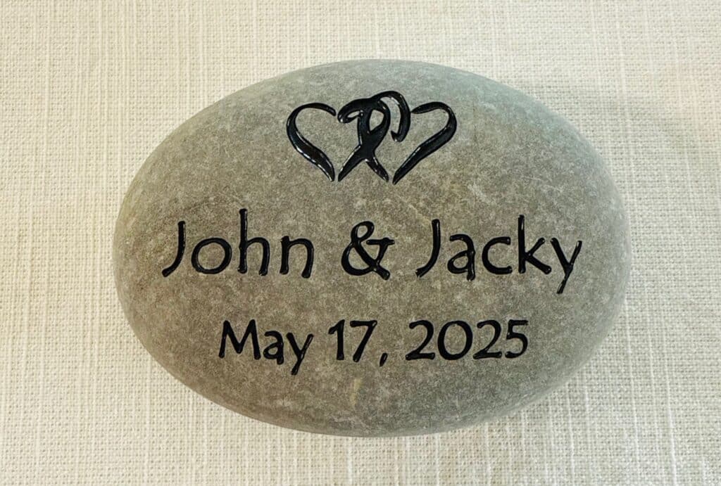 Wedding Rocks, engraved intertwined hearts with names John and Jacky on river stone. May 17, 2025