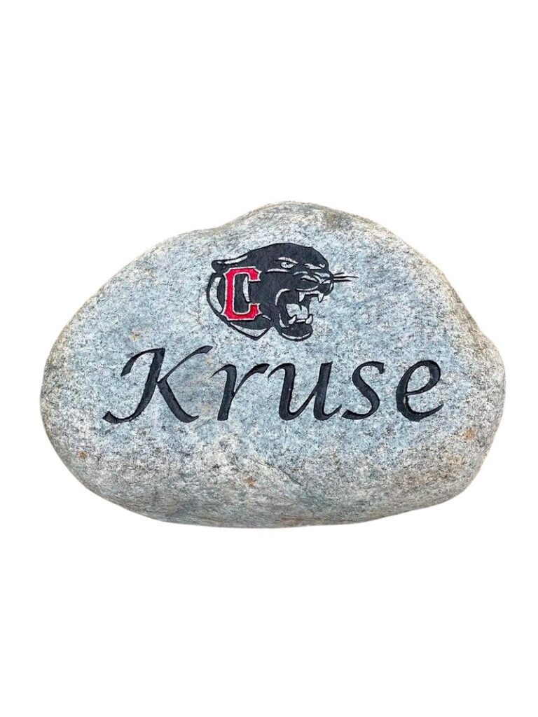 Engraved logo rock with text Kruse and School logo